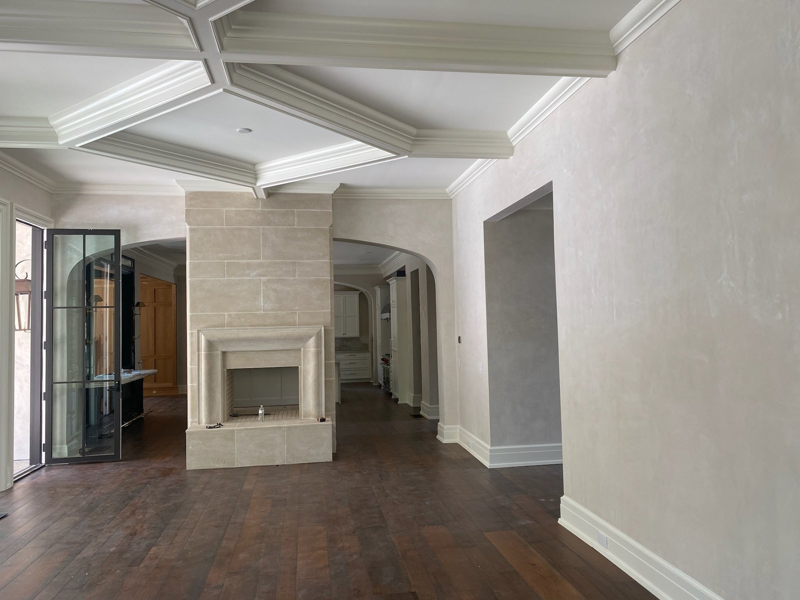 Interior plasterwork with a detailed ceiling and fireplace